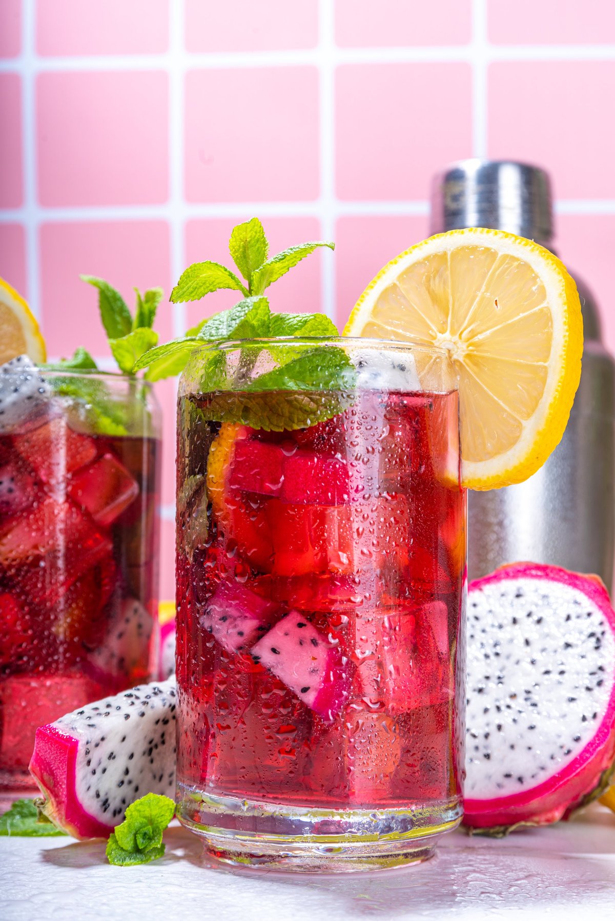 Sweet colorful tropical cocktail with dragon fruit, lime and mint